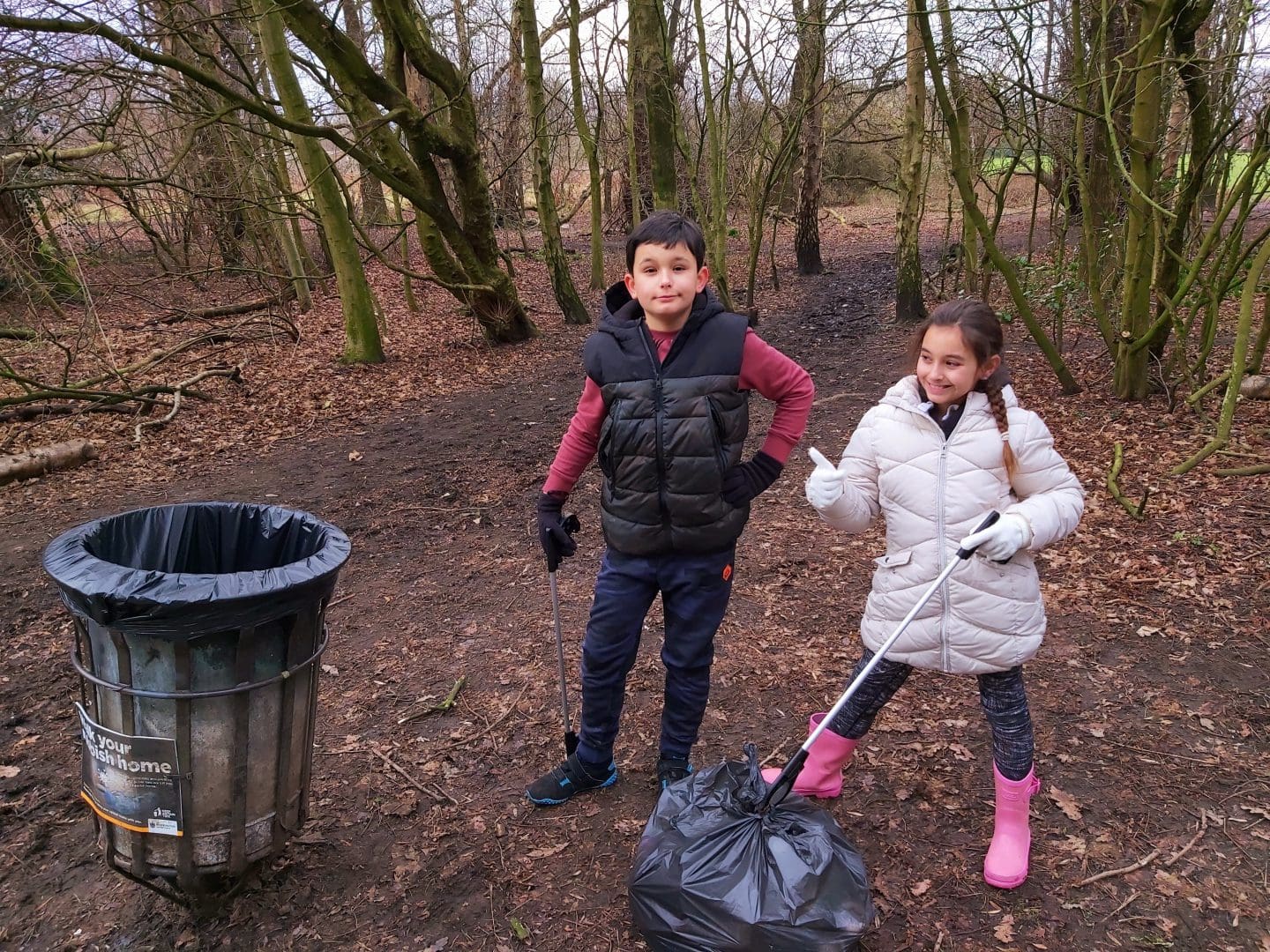 Ruben and Elena picking litter for 100 Acts of Kindness